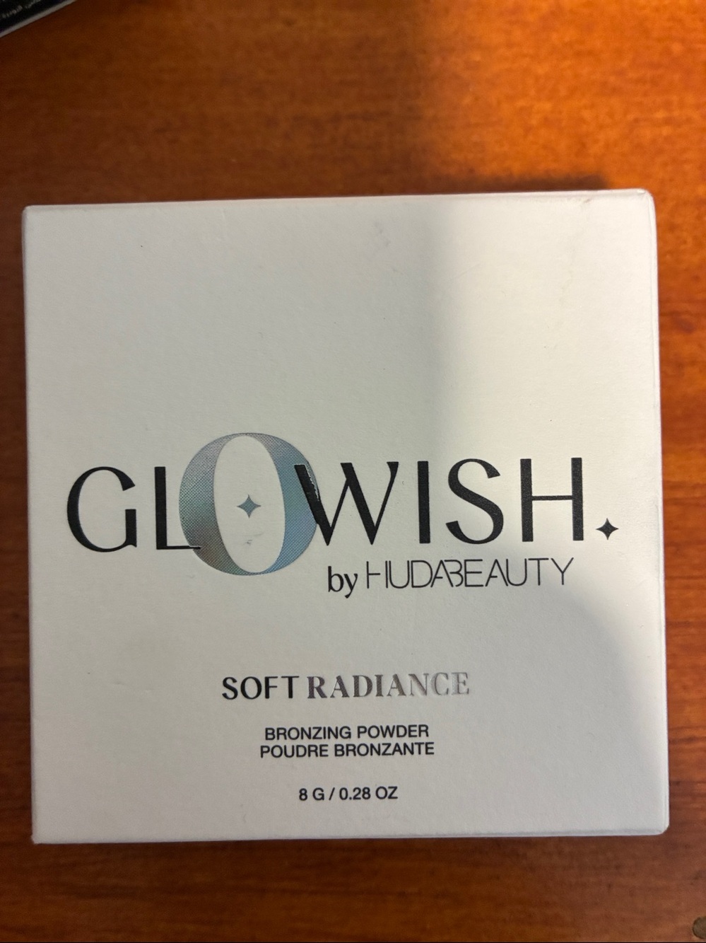 HUDA BEAUTY GloWish soft radiance bronzing powder in tan light. New in box!